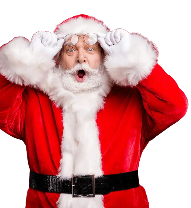 Santa Claus holding his glasses with both hands and looking surprised in a red suit with white fur trim
