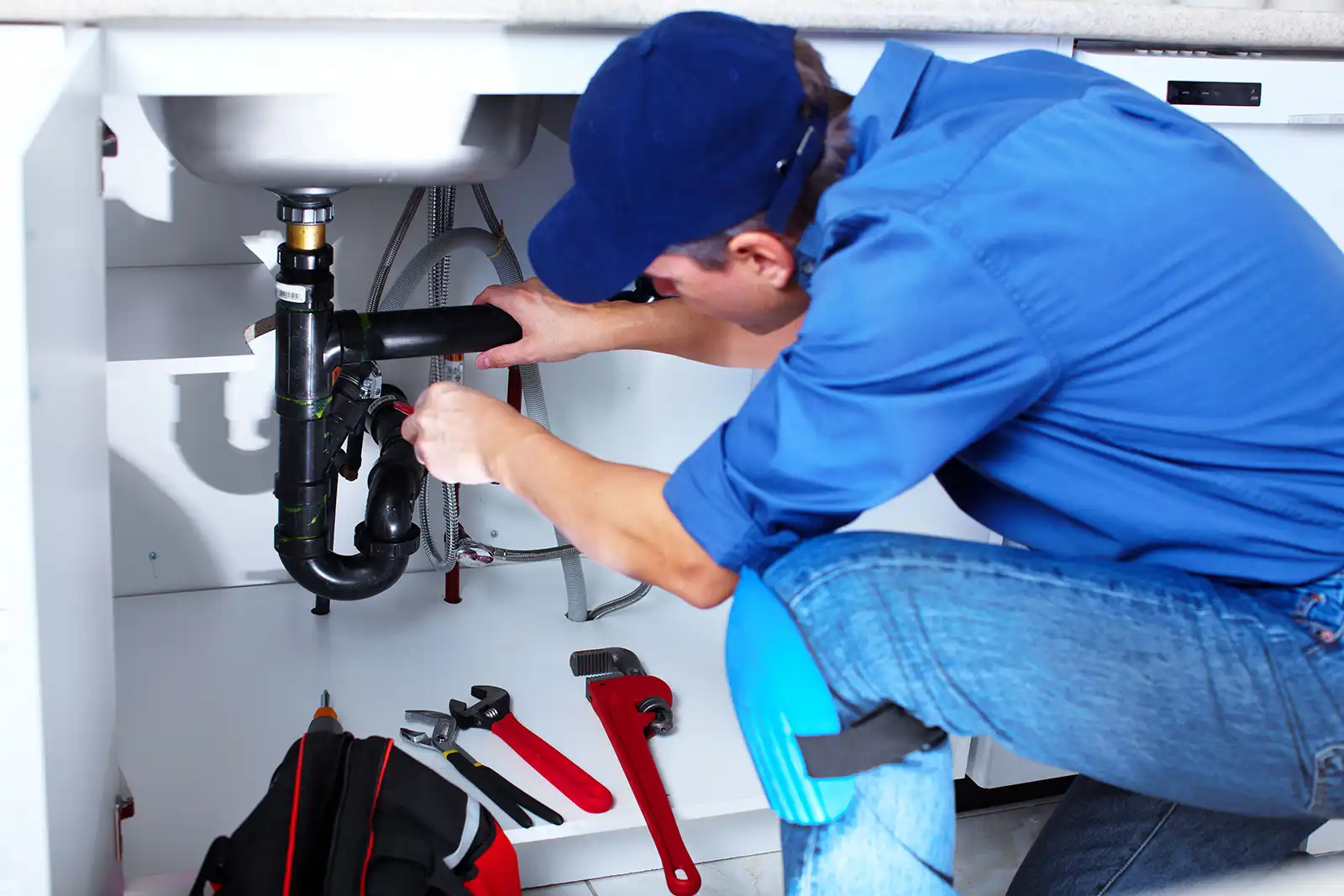 blue hat fixing pipes